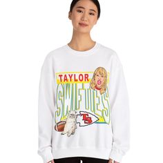 Recommended deadline for delivery by Christmas - Dec. 10 "Go Swifties!" 🏈 Featuring my original illustration of Taylor Swift in the style of Kansas Chief's logo & colors. Ultra soft, yet sturdy and easy to move around in, all the while looking good. Made from a high quality 50/50 blend for the perfect balance of the softness of cotton and the flexibility of polyester! Printed using DTG technology for bright, long-lasting designs! Unisex sizes, please check size chart for measurements. - Ships o Pop Culture Letter Print Sweatshirt In Relaxed Fit, Pop Culture Graphic Print Sweatshirt For Fans, Graphic Print Sweatshirt For Fan Merchandise, Relaxed Fit Graphic Sweatshirt For Fan Merchandise, Relaxed Fit Graphic Print Sweatshirt For Fans, Fan Apparel Sweatshirt With Logo Print In Relaxed Fit, Relaxed Fit Logo Print Sweatshirt Fan Apparel, Relaxed Fit Fan Apparel Sweatshirt With Logo, Band Merch Sweatshirt With Logo Print