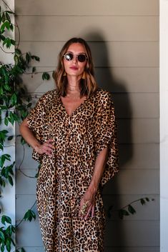 Unleash your wild side with the Lydia Leopard Caftan! Featuring a generous amount of luscious leopard print fabric, this caftan exudes luxury and glamour. Perfect for lounging or dancing, this caftan is a must-have for those who love to take risks and embrace adventure. Get ready to make a statement and stand out from the crowd with this bold and fierce caftan. Our caftans are a voluminous one-size fits all garment, approximately 50" in length. The intention of this shape is to celebrate the mag Printed V-neck Kaftan For Poolside, Festive Printed V-neck Kaftan, Festive V-neck Kaftan With Floral Print, Thea Porter Caftan, Chic Printed V-neck Kaftan, Take Risks, Friends Fashion, Wholesale Fashion, One Size Fits All