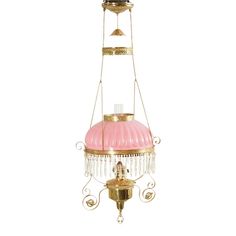 a pink and gold chandelier hanging from the ceiling with two lights on each side