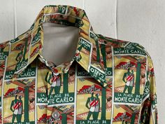 "Vintage 1970s disco shirt. Made of multi color print Nylon. Has all over Art Deco style print of bathers on a beach: La Place De Monte Carlo. Has long collar and button down front. Printed in Italy. Made by RAGS SHIRTMAKERS, size large. Actual measurements are:  50\" at the chest  46\" at the waist  18.5\" shoulder seam to shoulder seam  26\" shoulder seam to cuff  29\" overall length   In excellent condition." Retro Multicolor Graphic Print Shirt, Retro Multicolor Shirt With Vintage Print, Retro Graphic Print Patterned Shirt, Retro Graphic Print Shirt, Vintage Multicolor Shirt With All Over Print, Retro Multicolor Printed Shirt, Retro Shirt With Vintage Print In Patterned Color, Retro Patterned Shirt With Vintage Print, 70s Fashion Men