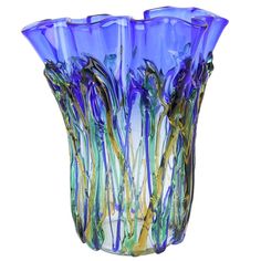 a glass vase with blue and green swirls