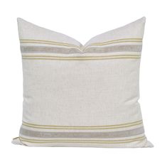 a white pillow with grey and yellow stripes