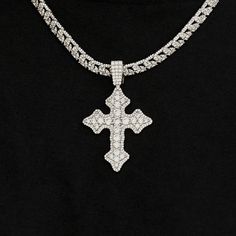 Introducing the Iced Gothic Cross in White Gold - a bold addition to your pendant collection. Crafted with a durable 14k White Gold finish and hand-set stones, this cross is guaranteed to make a statement! Pair this piece with our 5mm Tennis Chain in White Gold for a complete, elevated look. This product is guaranteed for life - GLD will repair the item should you experience any defects in craftsmanship or breakage. Specifications - 35mm x 42mm (Width x Height) - Bail: Fits up to 5mm Tennis Chai Gothic Cross, Gothic Crosses, Tennis Chain, Vermeil Jewelry, Custom Earrings, Pendant Bracelet, Drop Necklace, Chain Pendants, Chains Jewelry