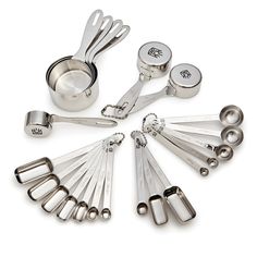 a collection of kitchen utensils and measuring spoons