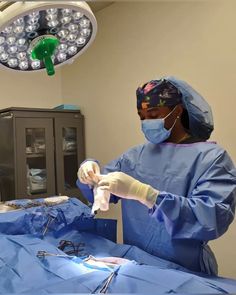 two doctors performing surgery in an operating room