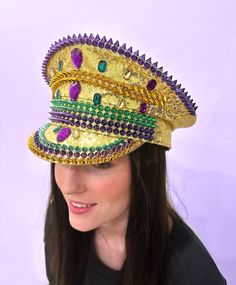 Be the conductor of your Mardi Gras parade in this wild sequin conductor hat! Each one comes in an energetic palette of purple, green, and gold - guaranteed to turn heads and cause a parade of compliments. Get yours today for a look that's not just on-beat, but off-the-charts funky! One Size Fits Most Gold Adjustable Hat For Costume Party, Adjustable Gold Hat For Costume Party, Adjustable Gold Hat For Carnival, Mardi Gras Festival Costume Hat With Round Crown, Adjustable Costume Accessories For Mardi Gras Carnival, Adjustable Gold Costume Hats And Headpieces For Carnival, Purple Mardi Gras Party Costume Hats And Headpieces, Adjustable Costume Accessories For Mardi Gras, Purple Mardi Gras Party Costume Hat