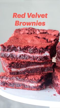 several red velvet desserts stacked on top of each other with one slice cut out