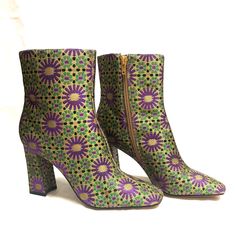 Size 8m/38. These Are Nwot Katy Perry Luvlie Ankle Booties. Stylish Eye-Catching Boots In A Gold Tone With Black, Purple, And Green Flower Type Pattern. They Come With A Side Zipper And A Nice Cushion For Comfort. A Block Heel Approx. 3 1/2” Completes The Style. Approx. Measurements: Shaft 5 1/2”; Top Circumference 11 1/4”. True To Size. Classy, Cute, Stylish, Eye-Catching. Fitted Purple Ankle Boots, Purple Booties, Irregular Choice Ankle Boot, Fitted Ankle-high Purple Boots, Katy Perry Shoes Collection, Tan Ankle Boots, Metallic Boots, Caged Heels, Black Boots Tall