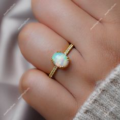 Gemstone : Natural Ethiopian Opal  Metal : 9K Gold / 14K Gold / 18K Gold / 925S Silver Gemstone Shape and Size : Oval 9x7 MM Gemstone Shape and Size : Round 1.50 MM  Gemstone Weight : 2.00 Ctr Metal Weight :  3.30 Gram ACCEPT CUSTOM SERVICE: 1. Accept change main stone type, size : Oval 9x7 MM 2. Accept change other material : This jewelry can also be made in solid gold (14K white/rose/yellow gold...) Please contact me if you have special requests. Thanks for your visiting! Ethiopian Opal Oval Ring For Wedding, Ethiopian Opal Oval Rings For Anniversary, Ethiopian Opal Gemstone Ring For Anniversary, Ethiopian Opal Ring For Wedding, Ethiopian Opal Anniversary Ring, Ethiopian Opal Gemstone Jewelry For Weddings, White Ethiopian Opal Ring For Wedding, White Ethiopian Opal Wedding Ring, Round Ethiopian Opal Jewelry For Wedding