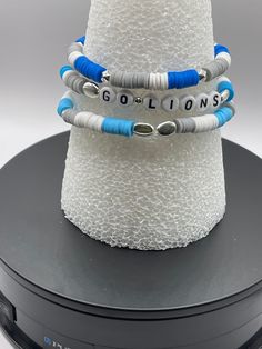 Bracelets Detroit Lions Bracelets.  Comfortable and durable.  Comes in sets or separately. Made with Honolulu Blue, Grey and white beads on strong band. Personalization is optional and any way you prefer, just list below how you prefer your bracelets to look. Most important lets support our Detroit Lions! I know we are all roaring for them as they totally desere it. These bracelets are vibrant colors, buy yours today or tomorrow and I will make sure you rec;d before game day. GO LIONS! Adjustable Stacked Blue Bracelets, Blue Stacked Bracelets With Round Beads, White Stacked Stretch Bracelet As Gift, White Stacked Stretch Bracelet Gift, Blue Stacked Beaded Bracelets, Blue Stacked Bracelets As Gift, Blue Stacked Bracelets Gift, Blue Stacked Bracelets For Gift, Adjustable Stacked Stretch Bracelet For Friendship