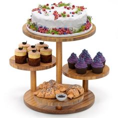 three tiered cake stand with cupcakes and cakes on it's sides