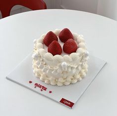 there is a cake with strawberries on it