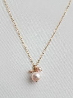 For a blushing bride OR her blushing bridesmaids! This delicate blush pearl and swarvoski crystal charm necklace adds the perfect finishing touch to any styled look. Whether it be for every day wear or a special occasion, you will be sure to make the girls blush by gifting them one of these! Contact us for special discounts on orders 3 or more! The Details: - Blush pearls and swarvoski crystal charm necklace comes adorned on a standard 18" chain  - Customize these necklaces by choosing your pref Colored Pearl Necklace, Blushing Bride, Jewelry Bridesmaid, Etsy Bridesmaid Gifts, Wedding Item, Crystal Charm, Blush Color, Pearl Color, Bridesmaid Jewelry