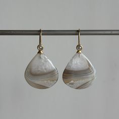 Rose cut diamonds top the peaks of these mountainous Botswana agate drops. 18k yellow gold Botswana agates, 24.77ctw, 20mm x 22mm (13/16" x 7/8") Diamonds, 0.32ctw, 3mm in diameterEarrings hang 1 7/16" from the ear Each earring weighs 3.1g Earrings With Diamonds, Diamond Top, Botswana Agate, Newport Ri, Rose Cut Diamond, Botswana, Teardrop Earrings, Rose Cut, Newport