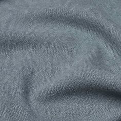 a close up view of the texture of a fabric material, with grey color and pattern