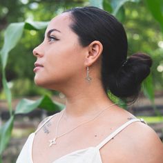 Enchanting all who visit, the desert vibrates with life in a sacred cycle powered by the sun. With the blessing of Zia Pueblo from which this symbol originates, we invite you into the rays of this design that represent the four seasons, directions, stages of life, and quarters of the day. Find yourself empowered as you wear this sterling silver zia necklace, handcrafted by a diverse collective of artisans under the T.Skies roof, in the Land of Enchantment. 18" Sterling Silver Chain 1" Diameter P Nickel-free Teardrop Pendant Jewelry For Everyday Wear, Pierced Sterling Silver Cross Jewelry, Pierced Cross Pendant Jewelry Gift, Nickel-free Sterling Silver Cross Pendant Jewelry, Sterling Silver Cross Pendant Charm Necklace, Sterling Silver Charm Necklace With Silver Clasp, Engraved Sterling Silver Dangle Jewelry, Bohemian Sterling Silver Pendant Charm Necklaces, Bohemian Sterling Silver Charm Necklace