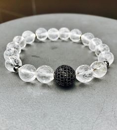 "Get this beauty while it last! Handmade high quality energy clearing natural stone silver beaded bohemian bracelet for women made from natural 10 mm clear faceted quartz gemstone beads. This beautiful piece includes silver rhinestone spacer beads, black diamond round pave crystal cubic zirconia bead and its beaded stretch  Clear faceted quartz beaded bracelet, diamond black pave bead bracelet, bracelet for women, gemstone bracelet, energy clearing bracelet  Quartz 💎 is the most powerful healing stone of the mineral kingdom, able to work on any condition. Clear Quartz is known as the stone of power and amplifies any energy or intention. Clear Quartz protects against negativity, attunes to your higher self, and relieves pain. 7\" in length, if you require a different size please let me kno Sunstone Bracelet, Jasper Bead Bracelet, Energy Clearing, Creative Friends, Swarovski Crystal Hearts, Bracelet Diamond, Pave Beads, Swarovski Crystal Bracelet, Jasper Bracelet