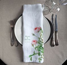 a place setting with napkins and silverware