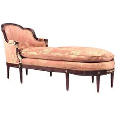 an antique chaise lounge chair with ornate upholster