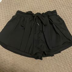 Black Flowy Butterfly Shorts Built In Shorts Never Worn Black Short Leg Bottoms For Night Out, Black Bottoms For Night Out With Short Legs, Black Short-leg Bottoms For Night Out, Black Short Pants For Spring, Black Pants With Built-in Shorts For Night Out, Black Elastic Waistband Bottoms, Short Length, Black Shorts With Built-in Shorts For Night Out, Chic Black Shorts With Elastic Waistband, Chic Black Short Leg Bottoms