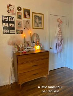 a room with a dresser and pictures on the wall next to a door that says, a little room tour per request