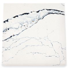 a white marble tile with black veining on the edges and an abstract design in the middle