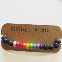 black lava bead bracelet with rainbow colored howlite beads Gay Pride Bracelet, Pride Bracelet, Colorful Bracelet, Rainbow Gift, Rainbow Jewelry, Beaded Jewelry Designs, Rainbow Bracelet, Chakra Bracelet, Unisex Bracelets