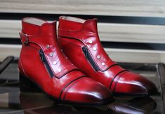 Handmade Red Color Zipper Boots, Leather Buckle Boots For Men's Description: Elevate your style with our Handmade Men's Leather Shoes, a testament to timeless elegance and meticulous craftsmanship. Crafted by skilled artisans, these shoes embody the perfect blend of sophistication and comfort, making them a must-have addition to your wardrobe. Features: Premium Materials: Our leather shoes are made from the finest full-grain leather, ensuring durability and a luxurious feel. The leather is hand- Red Party Boots With Zipper Closure, Rugged Red Boots With Reinforced Toe, Red Leather Boots With Buckle Closure, Red Leather Boots With Zipper Closure, Elegant Red Boots With 4-inch Heel, Mens Brown Boots, Oxblood Leather, Luxury Boots, Brown Loafers