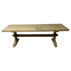 an old wooden table with two legs and a wood top, on a white background