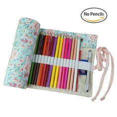 an assortment of colored pencils and pens in a case with a ribbon on the side