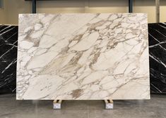 a large marble slab sitting on top of a tiled floor