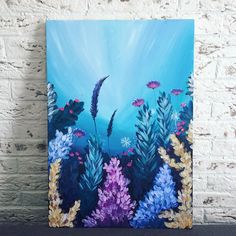 an acrylic painting of seaweed and other marine life on a brick wall