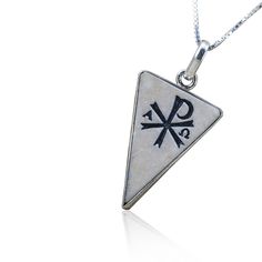 "This is a silver pendant, curved with chi rho on Jerusalem stone The chi rho is one of the earliest Christian symbols. It consists of the first two (capital) letters of Greek word \"ΧΡΙΣΤΟΣ\" = Christ in such a way to produce the monogram There are many versions of the Chi Rho , sometimes, combined with the alpha and omega or other symbols. Stone size: HPS-N (18 mm, length: 25 mm) / (0.7Inch X0.98Inch) Stone: Natural Jerusalem stone Silversmith's work: Handmade Material: Silver 925 Type: Pendan White Sterling Silver Amulet Necklace, Symbolic White Engraved Jewelry, White Symbolic Engraved Jewelry, Symbolic White Jewelry With Polished Finish, White Symbolic Jewelry With Polished Finish, White Sterling Silver Symbolic Necklace, White Symbolic Pendant Necklace, The Alpha And Omega, Silver Wedding Gifts