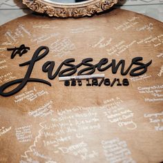 a table with writing on it in front of a mirror that says jassens