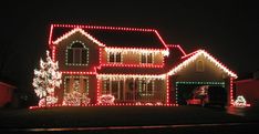 a house covered in christmas lights at night