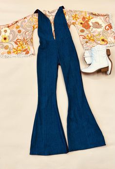 - Express Your Unique Vibe -  Get ready to groove in style with our Kids Denim Retro Style Jumpsuit! Made from soft and durable denim fabric, this jumpsuit is the perfect combination of comfort and style. Featuring a vintage print exaggerated bell sleeve top with trim detailing and bell bottoms, this jumpsuit is available in light and dark wash denim options. Whether your child prefers the classic blue of light wash denim or the edgy look of dark wash denim, we've got you covered! Our Kids Denim Retro Style Jumpsuit is available in a range of sizes to fit children of all ages and body types. The playful design and comfortable fit make it a must-have for any fashion-conscious child who loves to have fun and express their individuality. So, whether your child is headed to a party or just pla High Rise Fitted Overalls For Fall, Fitted High Rise Overalls For Fall, Fitted High Rise Fall Overalls, Fitted High-rise Overalls For Fall, Fall High-rise Fitted Overalls, Retro Dark Wash Denim Jumpsuit, Retro Fitted Summer Overalls, Retro Fitted Denim Jumpsuit For Summer, Retro Fitted Overall Bottoms