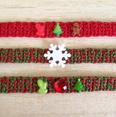 two crocheted bracelets with christmas decorations on them, one is red and the other is green