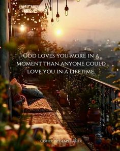 a balcony with lights hanging from the ceiling and a quote about god loves you more in a moment than anyone could love you in a lifetime