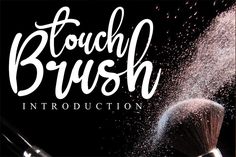 the words touch brush written in white on a black background with powder coming out of it