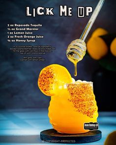 an advertisement for a lemon juice drink being poured into a glass with honey on it