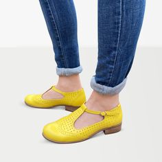 "These lovely summer mary jane shoes are of a yellow matt leather look. They have a hole punch design on the front with a t-bar shape and a buckle fastening to the side. Outer and inner material - perforated leather, closure - buckle fastener, sole - manmade, heel - 2.5 cm / 1.0\". --------Size Conversion & Feet Measurements-------- EU 34 US 4.0 UK 1.0 | 22.5 cm / 8.85\" EU 35 US 5.0 UK 2.0 | 23.0 cm / 9.05\" EU 36 US 6.0 UK 3.0 | 23.5 cm / 9.25\" EU 37 US 6.5 UK 4.0 | 24.5 cm / 9.64\" EU 38 Leather Mary Janes With Rubber Sole For Summer, Summer Leather Mary Janes With Rubber Sole, Retro Closed Toe Mary Janes For Summer, Summer Mary Janes With Leather Sole And Round Toe, Summer Mary Janes With Leather Sole, Summer Mary Janes With Leather Sole And Flat Heel, Summer Flat Heel Mary Janes With Leather Sole, Spring Retro Mary Janes With Round Toe, Retro Spring Mary Janes With Round Toe