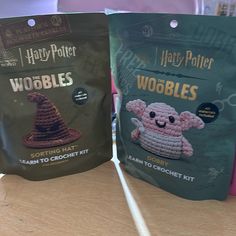 two harry potter wobbles bags sitting on top of a wooden table next to each other