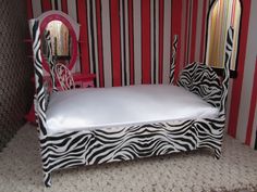 a zebra print bed and mirror in a room