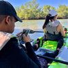 two men on a boat in the water