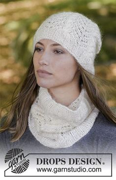 a woman with long hair wearing a white knitted hat, scarf and neck warmer