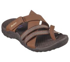 Explore the great outdoors in boundless comfort with Skechers Reggae - Sunday Stroll. This trail slide sandal features a synthetic and woven fabric upper with a cushioned comfort footbed. Brown Synthetic Slide Sport Sandals, Brown Slides With Arch Support For Outdoor, Brown Outdoor Slides With Arch Support, Comfortable Brown Slide Sport Sandals, Comfortable Brown Sport Slide Sandals, Adjustable Slides With Textured Footbed For Outdoor, Brown Slides With Arch Support For Vacation, Synthetic Slide Sandals For Outdoor Activities, Comfortable Open Toe Slides For Outdoor Activities