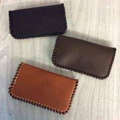 "You have a choice of black, brown or tan of the credit card purse made of cowhide leather. Metal snap and hand laced with leather calf lace and hand stitched for more strength. So double the strength. Enlarge the picture and you'll see the neat hand stitching around the purse. Measures about 5\" wide x 2-7/8\" high, opened 5-1/8\". Genuine leather. This coin purse is bigger for room to put credit cards in too, or business cards. In picture I have 12 credit cards in it. Made to last. Handy card Cheap Black Coin Purse, Brown Hand-stitched Card Holder For Gift, Brown Hand-stitched Card Holder Gift, Leather Hand-stitched Coin Purse For Everyday Use, Handmade Brown Card Holder For Everyday Use, Hand-stitched Leather Rectangular Coin Purse, Rectangular Hand-stitched Coin Purse For Daily Use, Hand-stitched Rectangular Leather Coin Purse, Brown Leather Coin Purse With Card Slots