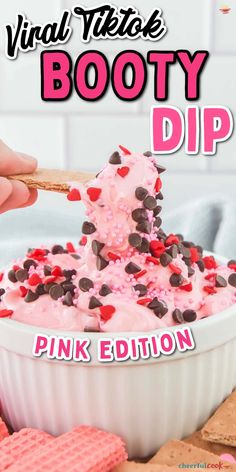 a bowl filled with pink ice cream and chocolate chips