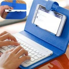 a person typing on a laptop with a blue case