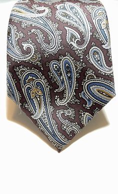 With NO visible imperfections, this tie is beautiful. Christian Dior 100% Silk 54.5" L 3" W Length Guide 1. Men That Are Under 5'10" If you are 5'10" or less, you'll want to make sure you get a tie that is between 54 - 57 inches in length.  2. Men That Are 5'10"-6'2" Men that are this height should choose a tie that is 57-59 inches long.  3. Men That Are Over 6'3" Very tall men should get a tie that is 61-63 inches long and at least 3" wide. Classic Paisley Print Suit And Tie Accessories For Semi-formal, Classic Patterned Suit And Tie Accessories, Classic Patterned Neckwear For Business, Formal Patterned Ties With Paisley Print, Classic Paisley Print Patterned Ties, Mens Accessories Vintage, Tall Men, Paisley Tie, Vintage Christian Dior